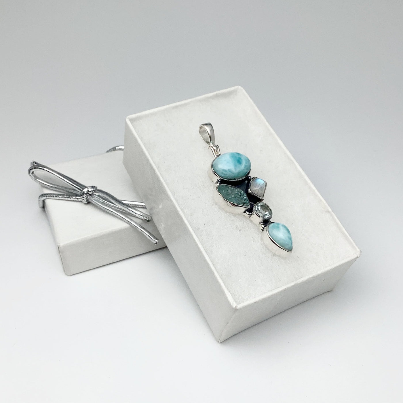 Larimar, Aquamarine, Rainbow Moonstone and Blue Topaz Pendant