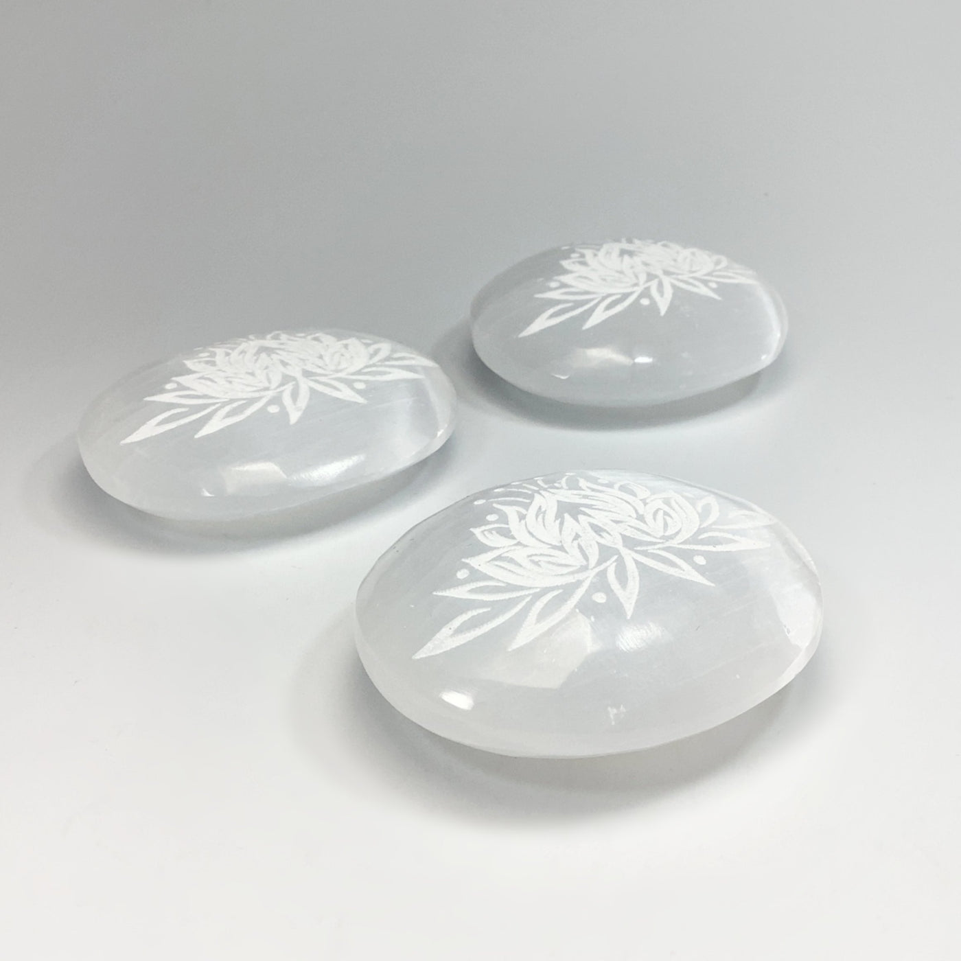 Selenite Palm Stone with Lotus Flower Engraving
