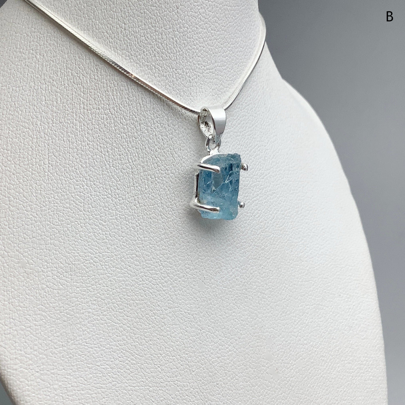 Raw Aquamarine Pendant at $125