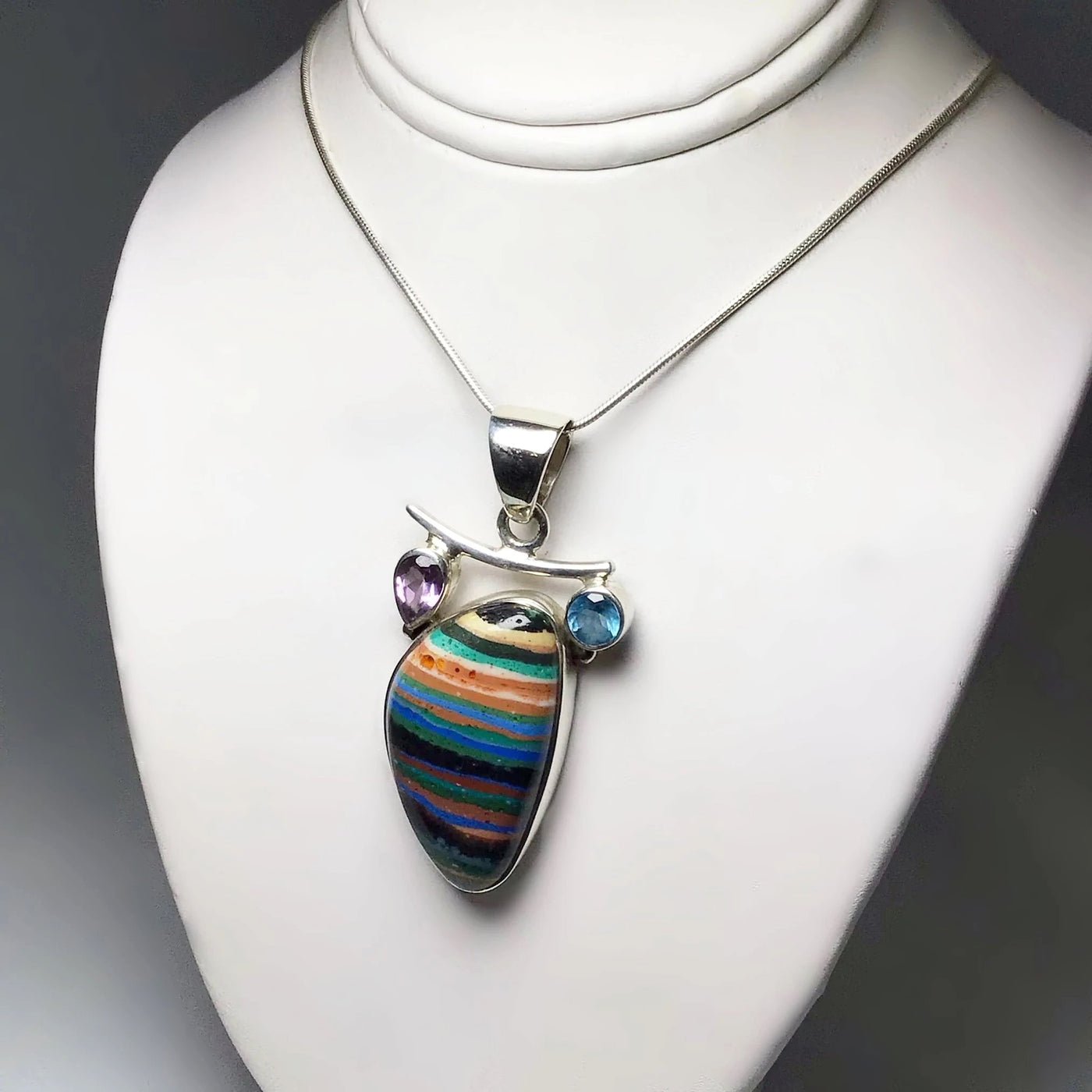 Rainbow Calcite, Blue Topaz and Amethyst Pendant