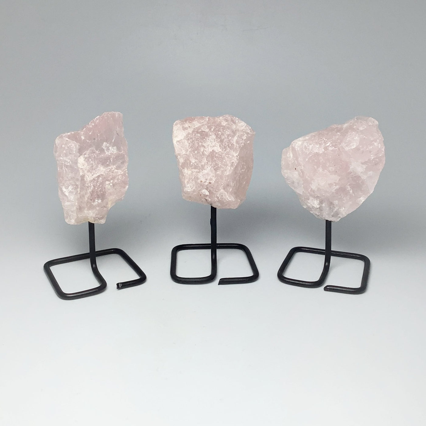 Rough Rose Quartz on Stand at $25 Each
